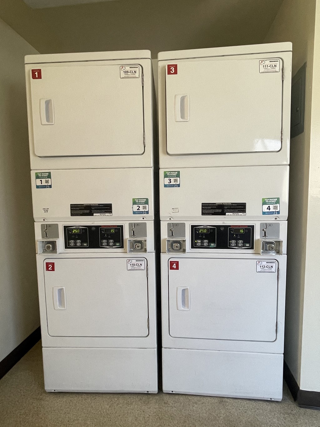 two refrigerators are shown next to each other in a room