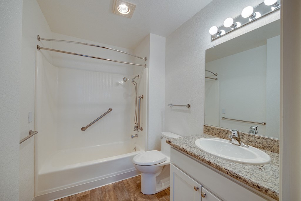 a bathroom with a sink toilet and a shower