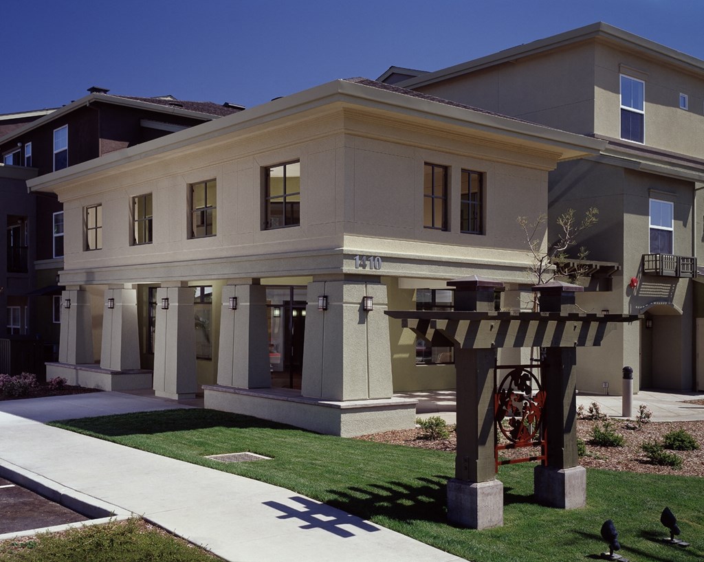 a large house with a sidewalk in front of it