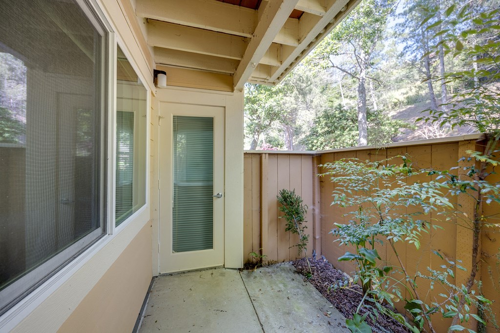 the front porch of a home with a glass door