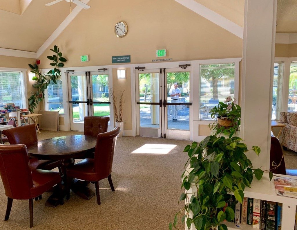 a dining room with a table and chairs