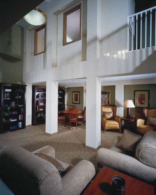 a living room with a couch and a table