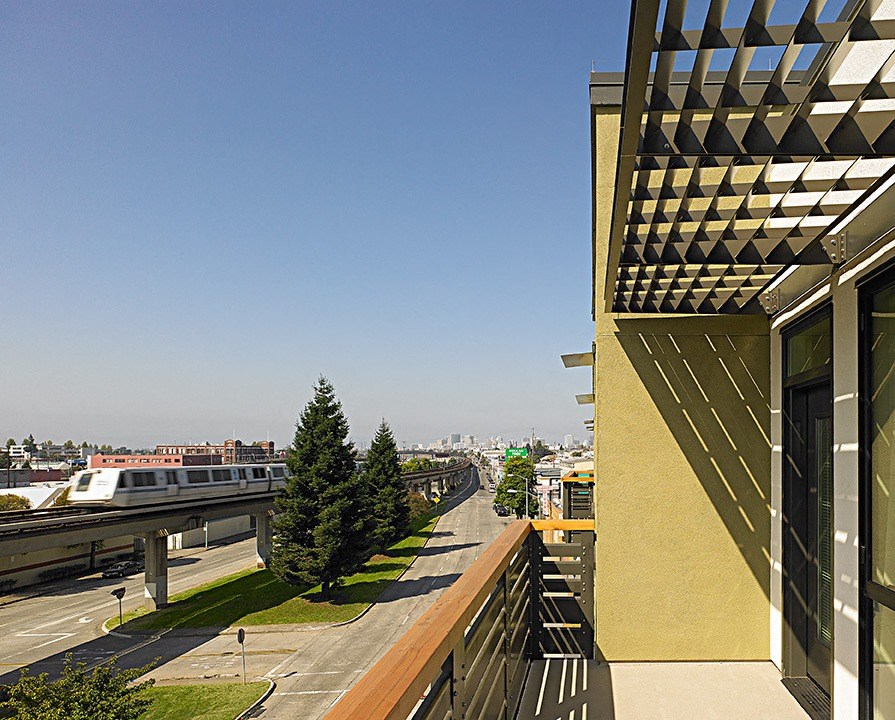 a view of the city from the balcony of a building
