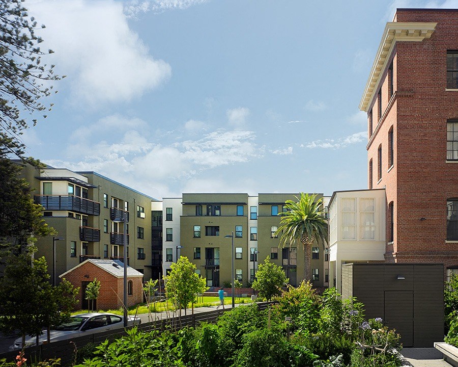 a rendering of an apartment building on a city street