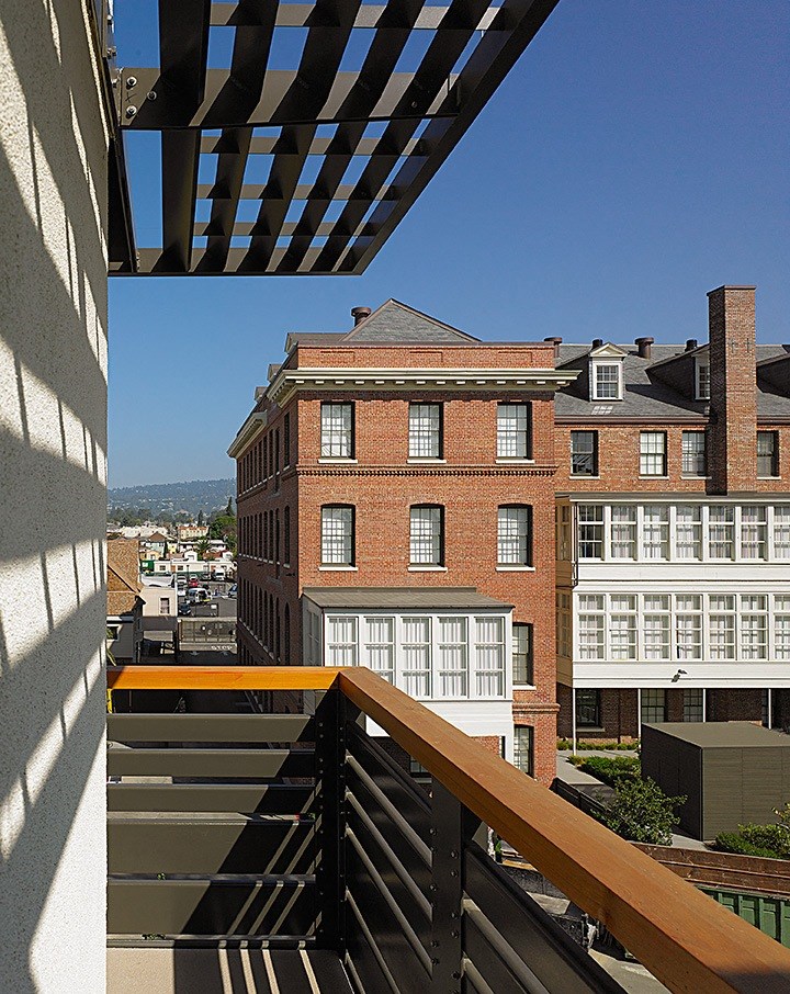 a view of the city from the balcony of a building