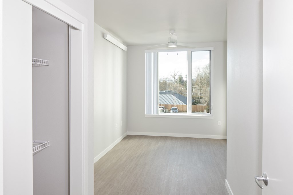 a living room with a window and a door