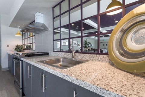 a kitchen with a sink and a large window