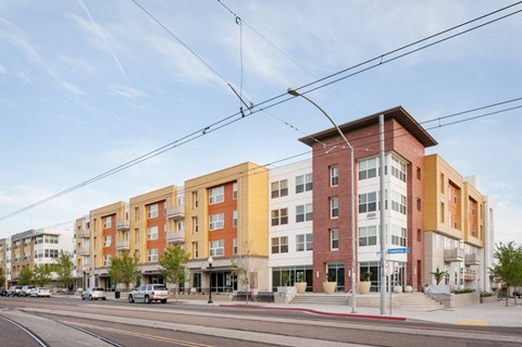 a row of new apartment buildings on a city street