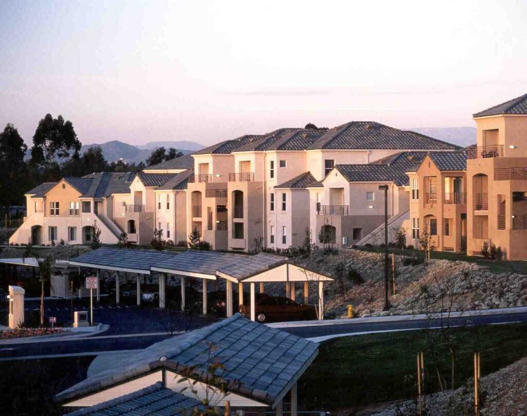 an aerial view of a row of houses on a street