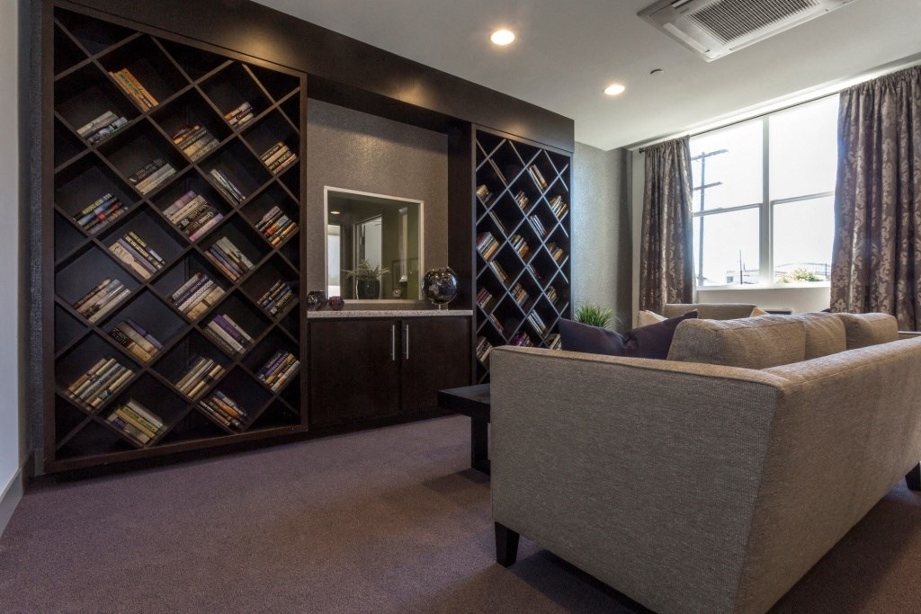 a living room with a bookshelf and a couch