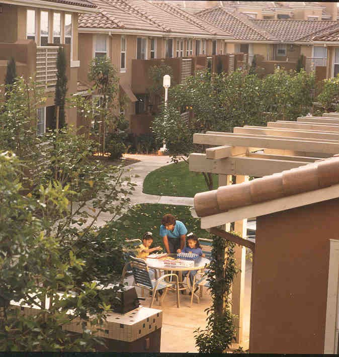 a man and two children sitting at a table