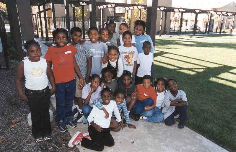 a group of young children posing for a picture