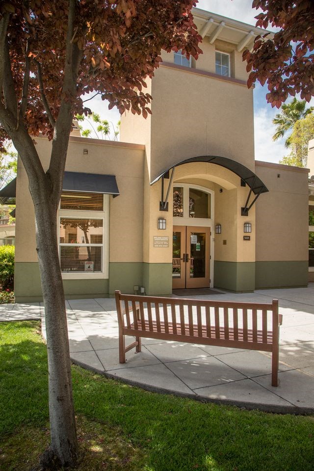 a bench sitting in front of a building