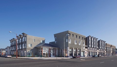 a large building on the corner of a city street