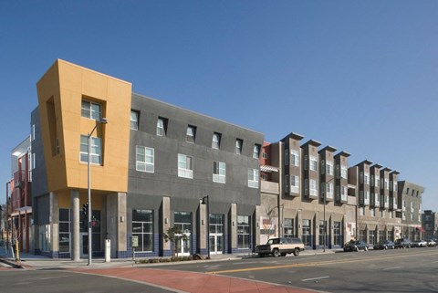 a new apartment building on the corner of a city street