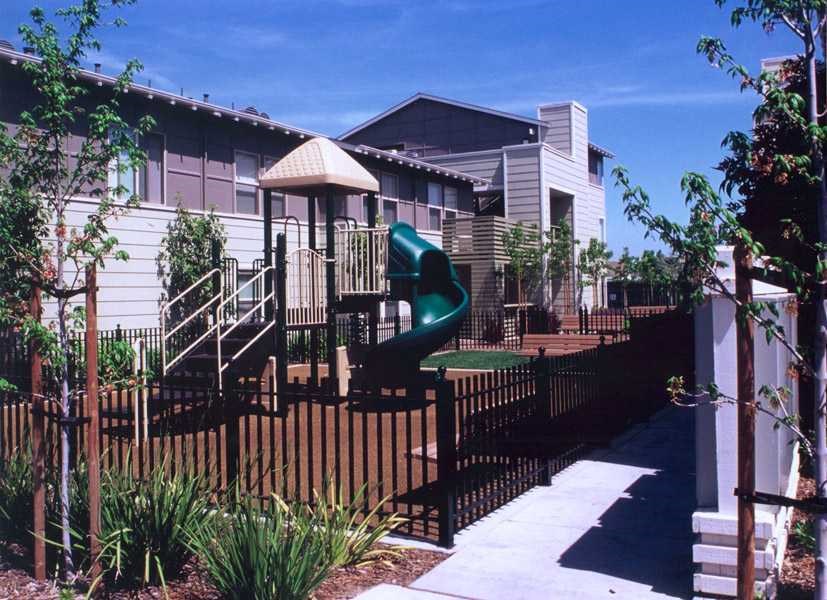a backyard with a playground and a slide