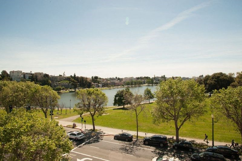 a view of a park and a river from a window