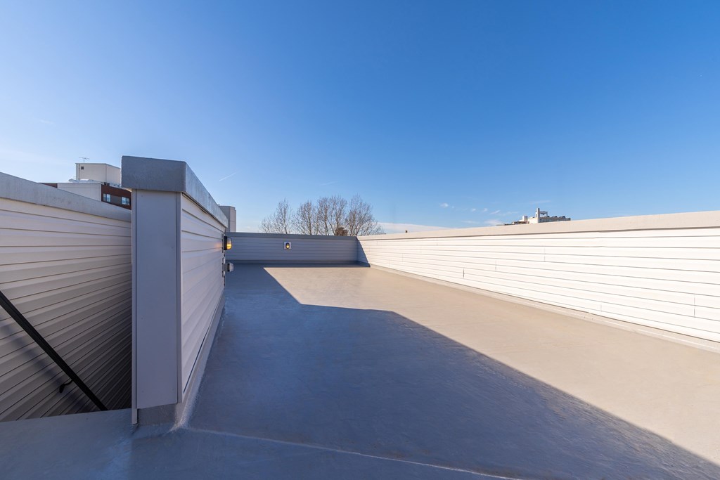 the roof of a building with a blue sky