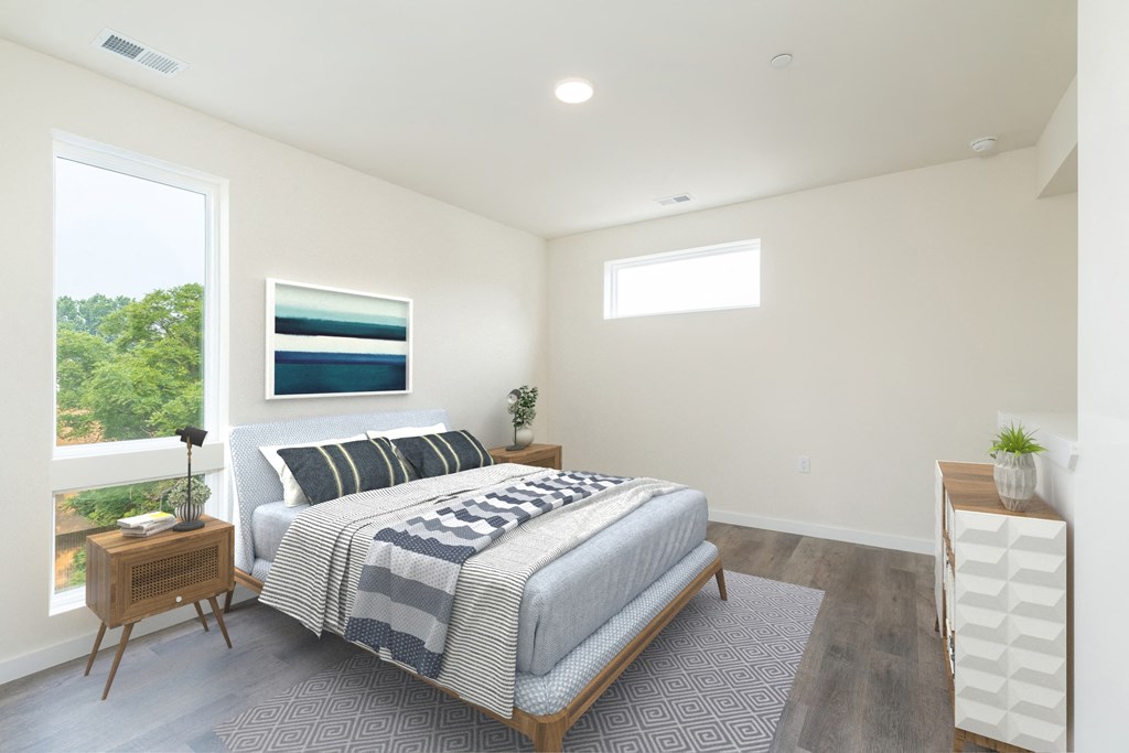 a bedroom with a bed and a window