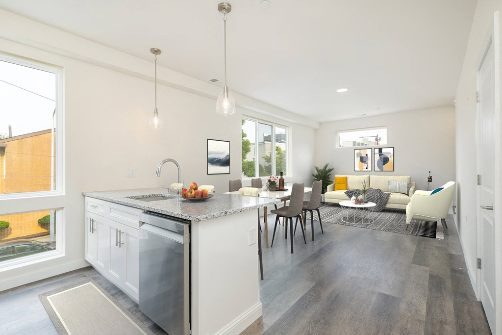 a living room with a kitchen and a dining room