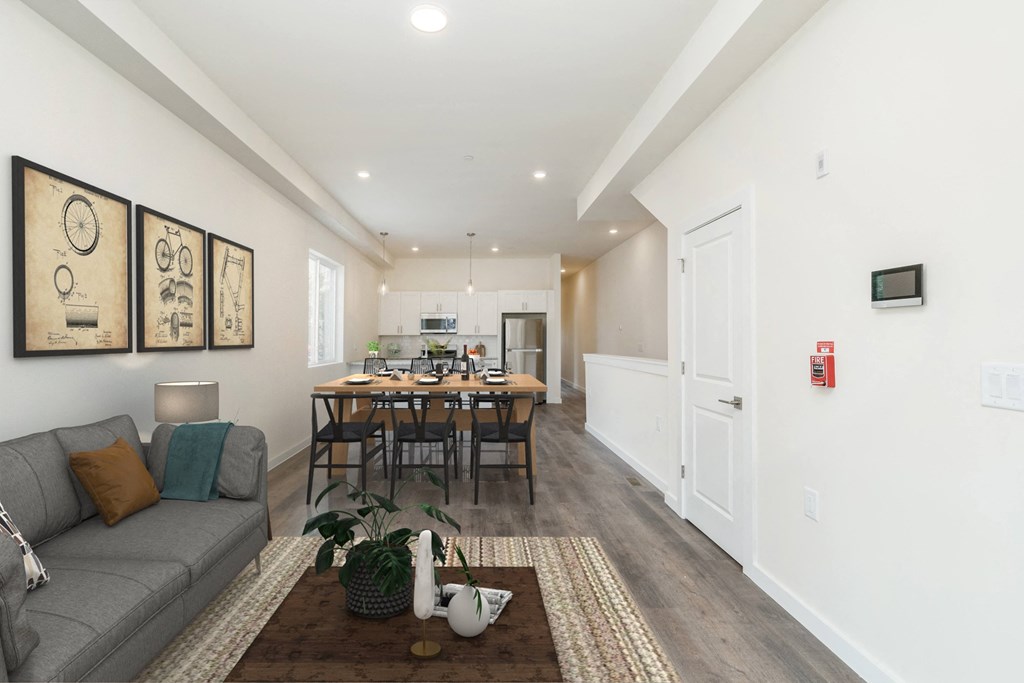 a living room with a couch and a dining room table