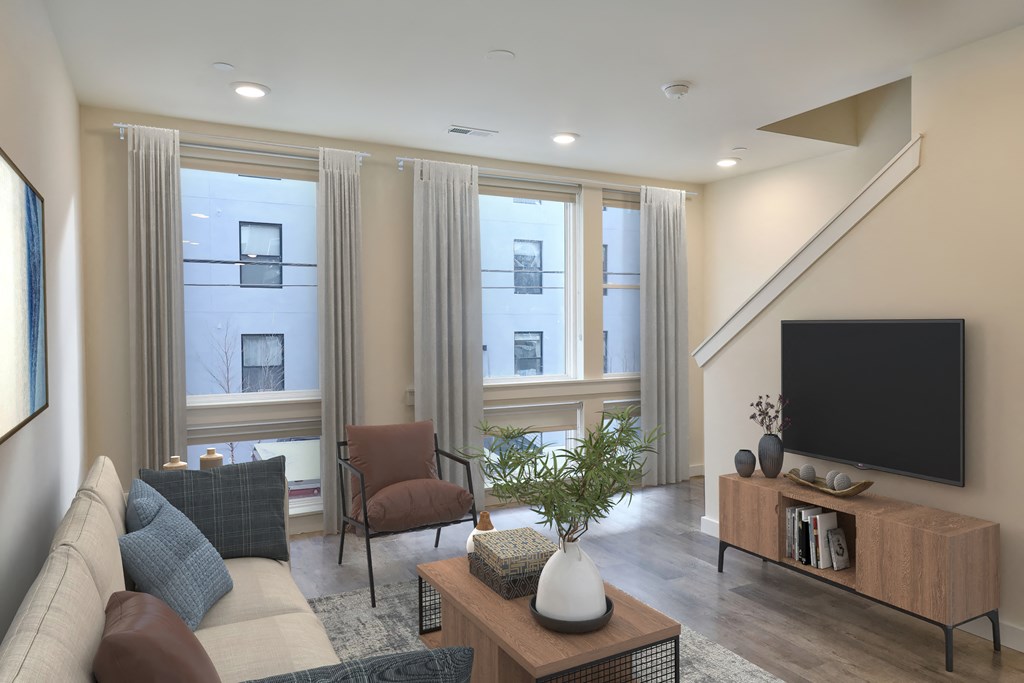 a living room with a couch and a tv