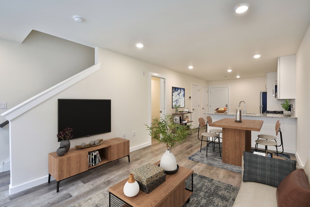 a living room with a couch and a table and a tv