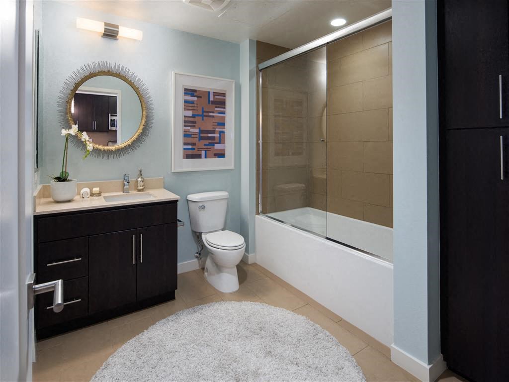 a bathroom with a sink toilet and a shower