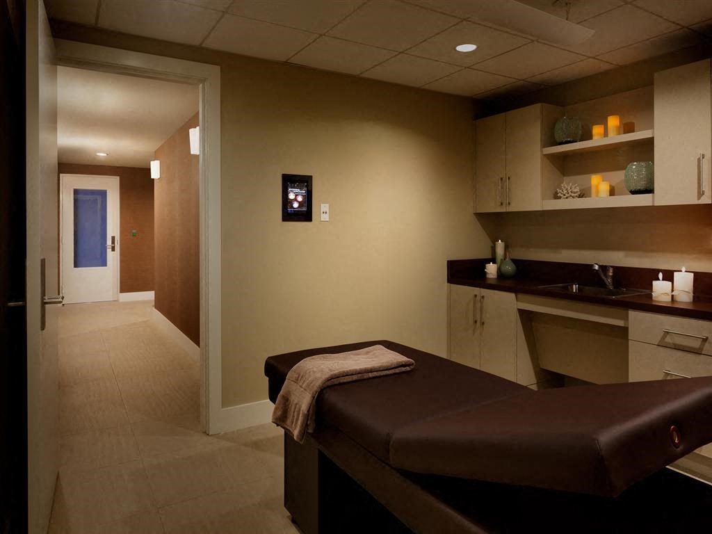a spa room with a brown bench and a sink