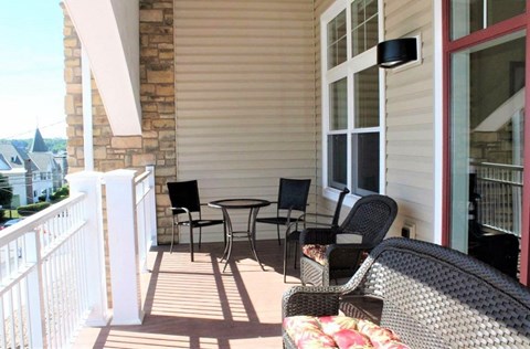 A patio with a table and chairs is shown.