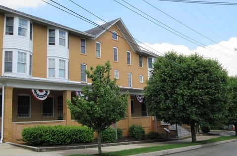 A building with a red, white and blue sign on the front.