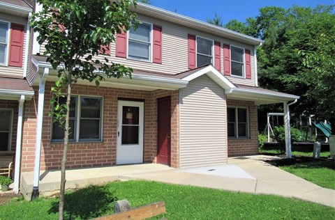 A house with a red door and a red window.