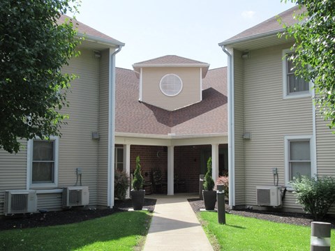 A building with a circular window on the roof.