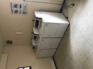 A white air conditioning unit is on the wall.