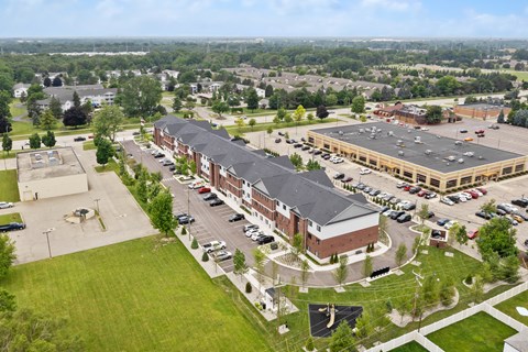 an aerial view of an office building and parking lot