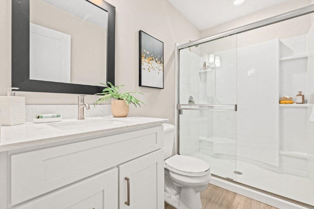 a bathroom with a sink toilet and a shower