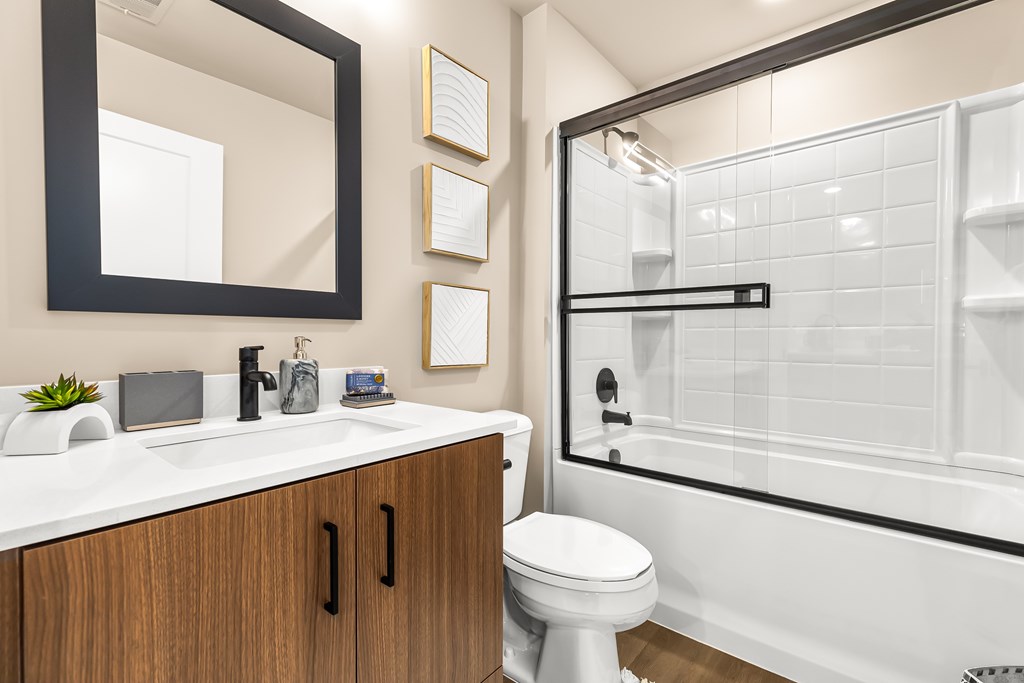 A bathroom with a white toilet and a white sink.