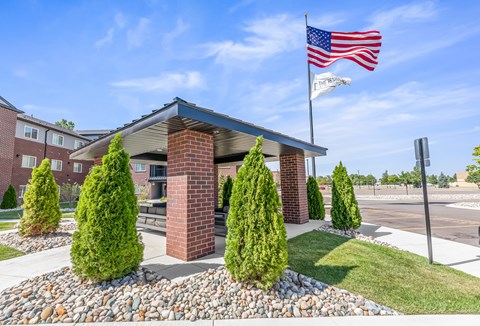 A patio building with an American flag on top of it.