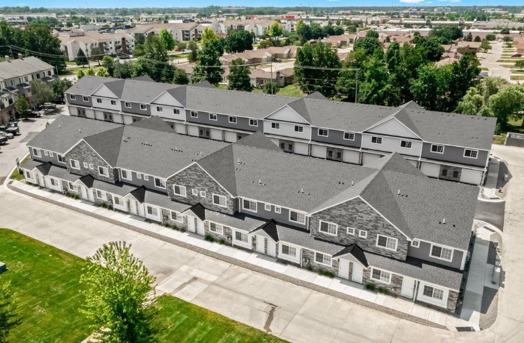 an aerial view of a row of houses in a neighborhood