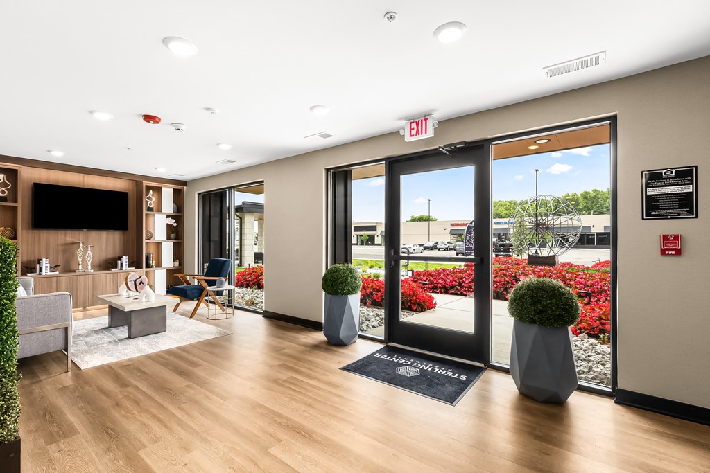 a resident clubhouse with wood flooring and glass doors