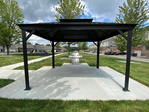 a picnic pavilion in the middle of a park