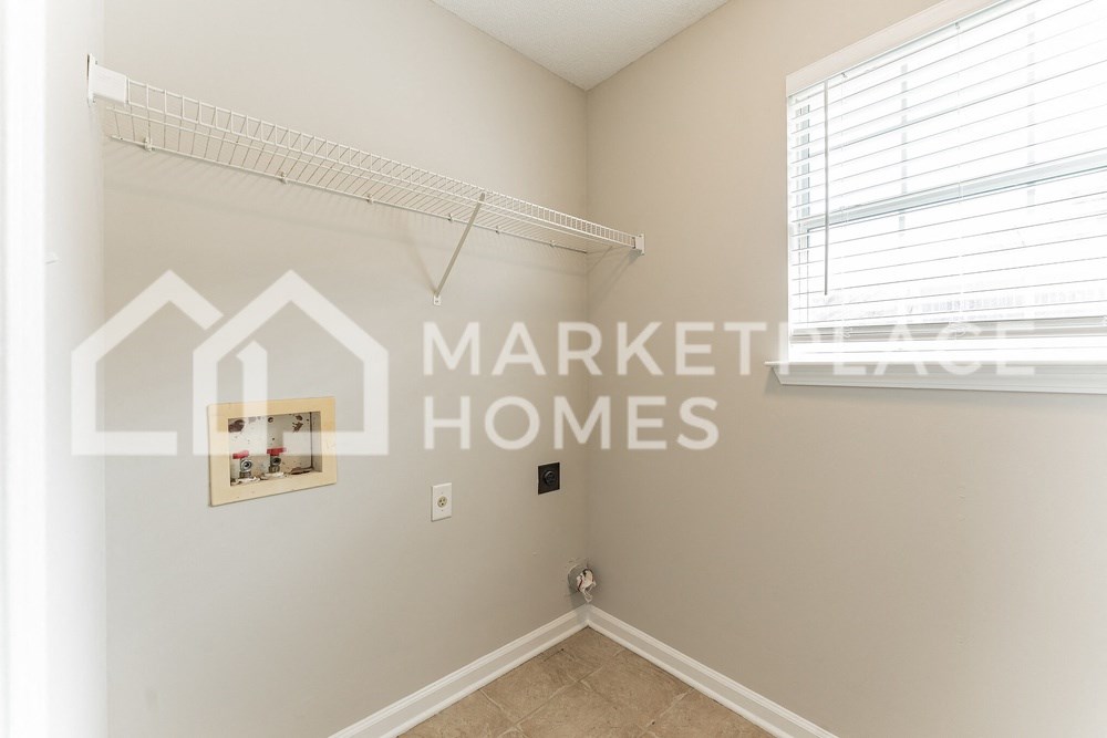 a bedroom with a closet and a window