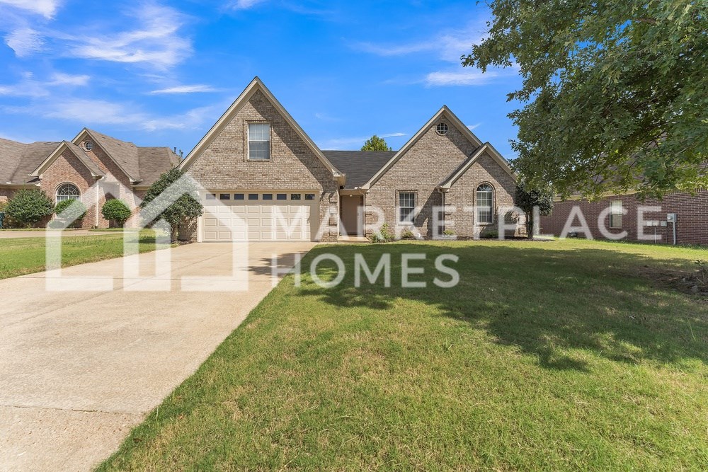 a large house with a lawn in front of it