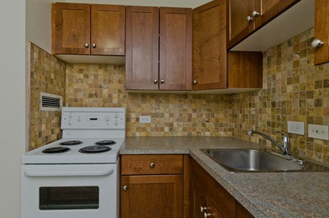 a kitchen with a stove and a sink