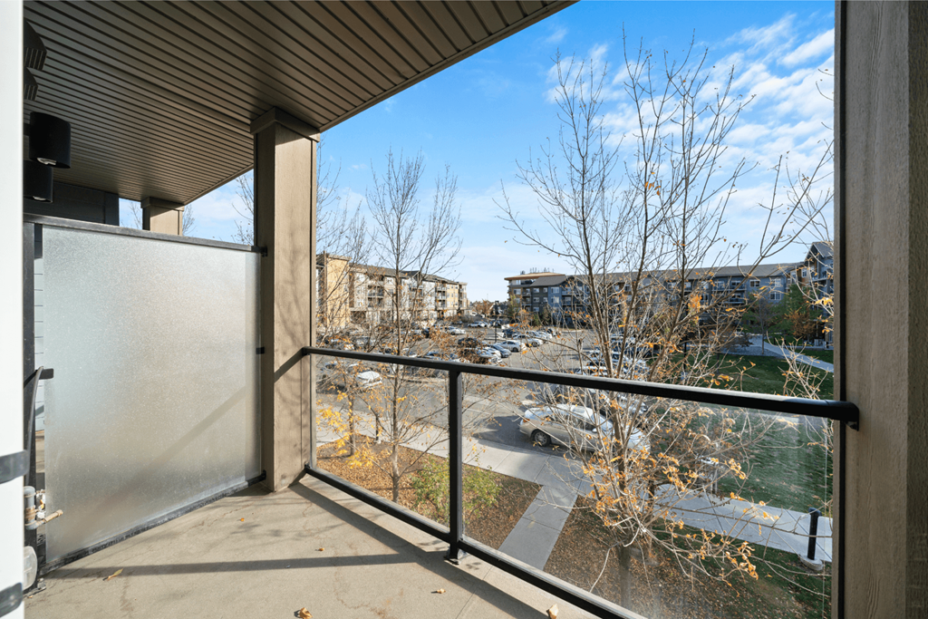 the view of the city from the balcony of a condo