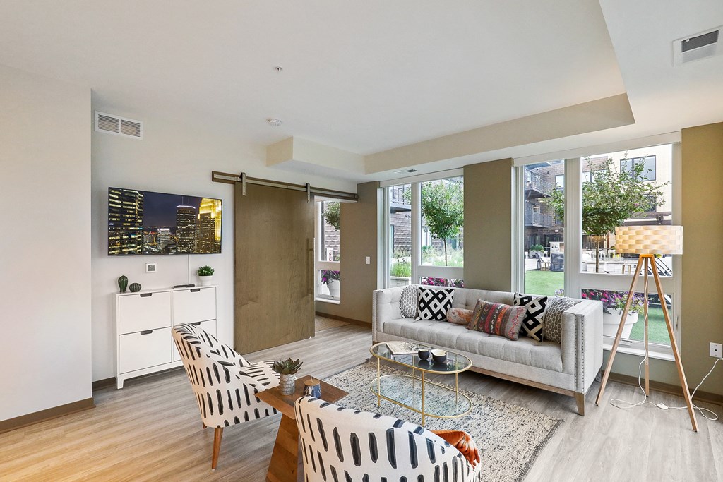 a living room with a couch and two chairs