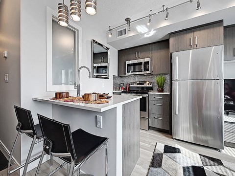 a kitchen with stainless steel appliances and a counter top