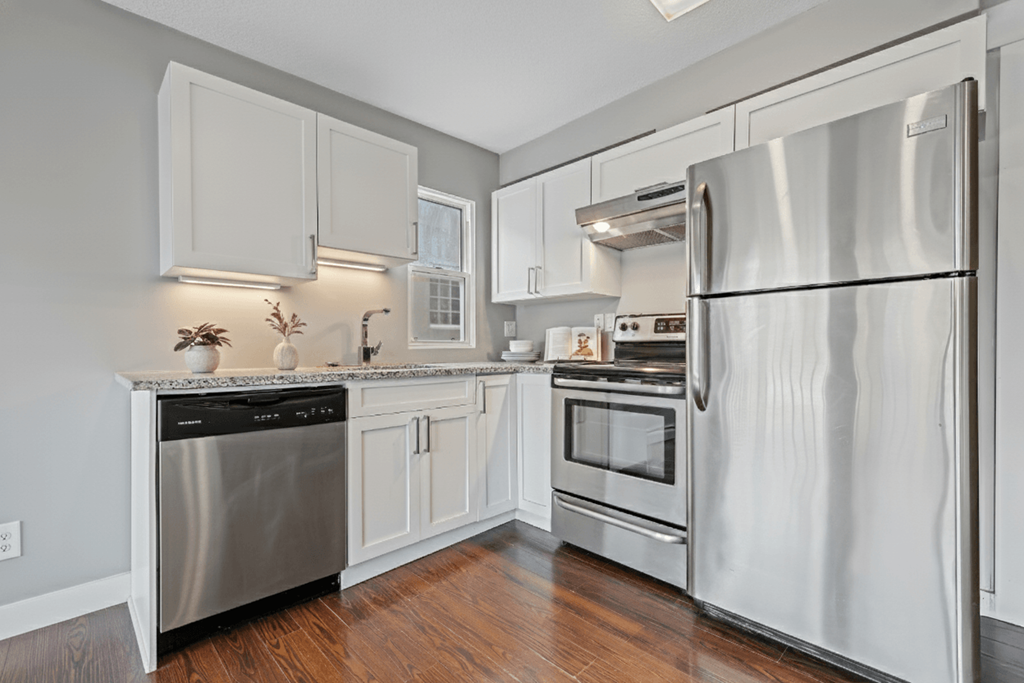 A modern kitchen with a stainless steel refrigerator.