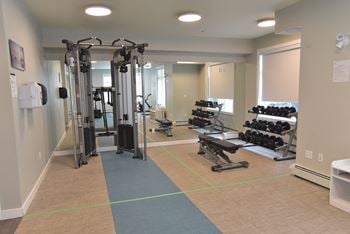 Aqua Residential rental apartments fitness centre with free weights