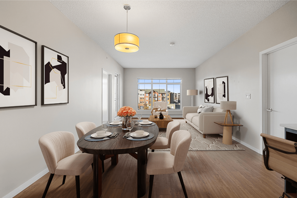 a living room and dining room with a table and chairs
